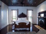 Master Bedroom with a antique 9` tall Victorian walnut queen size bed
